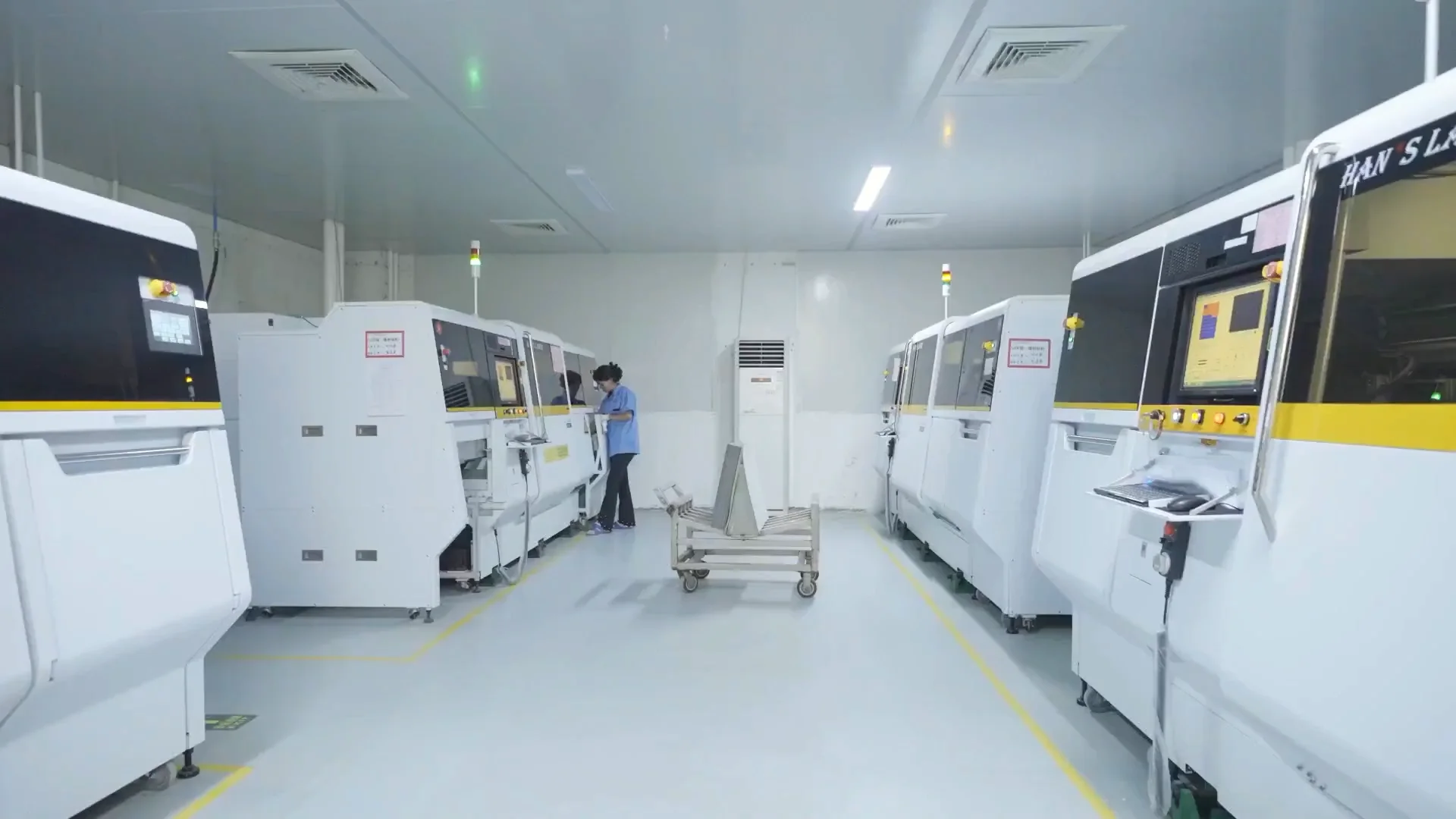 laser drilling equipment and an operator in a clean pcb production area. Laser drilling equipment and an operator in a clean PCB production area.