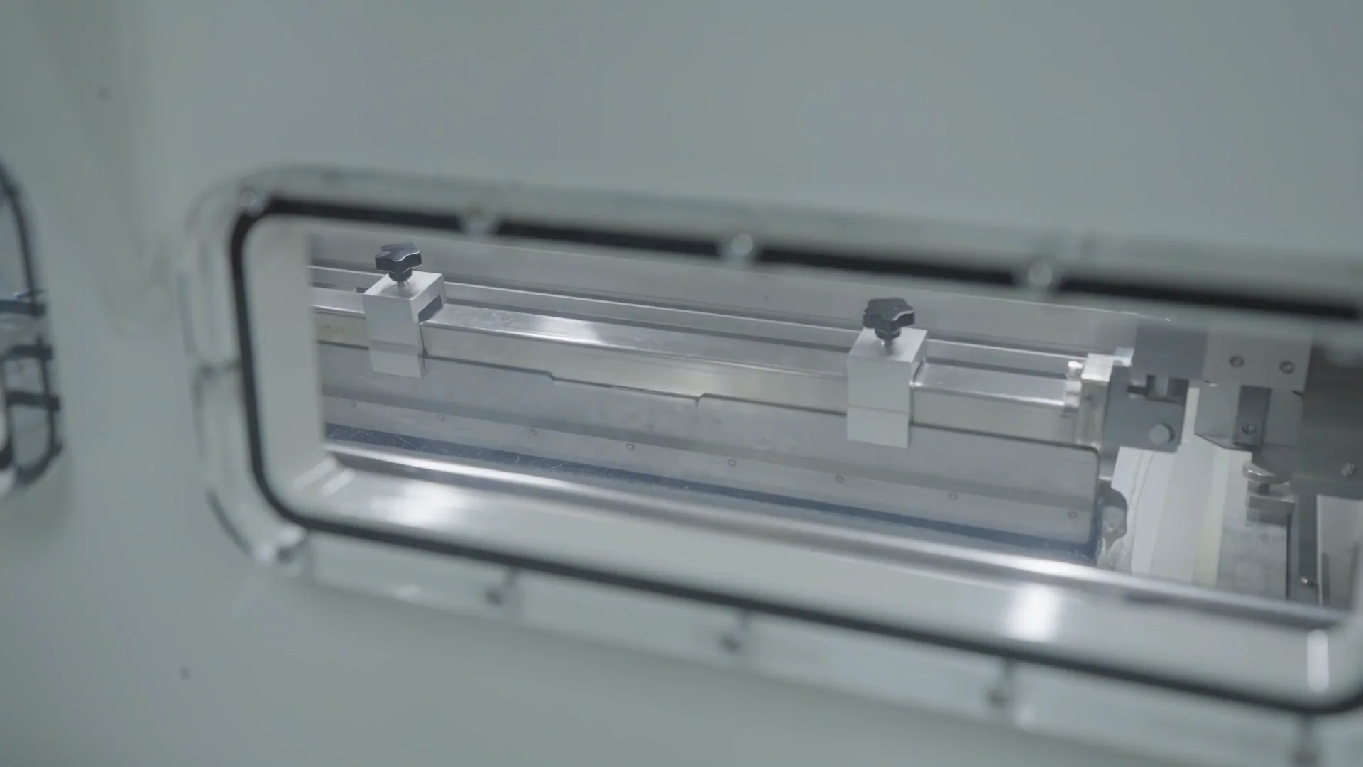 Close view of equipment used for resin via plugging on a PCB panel.