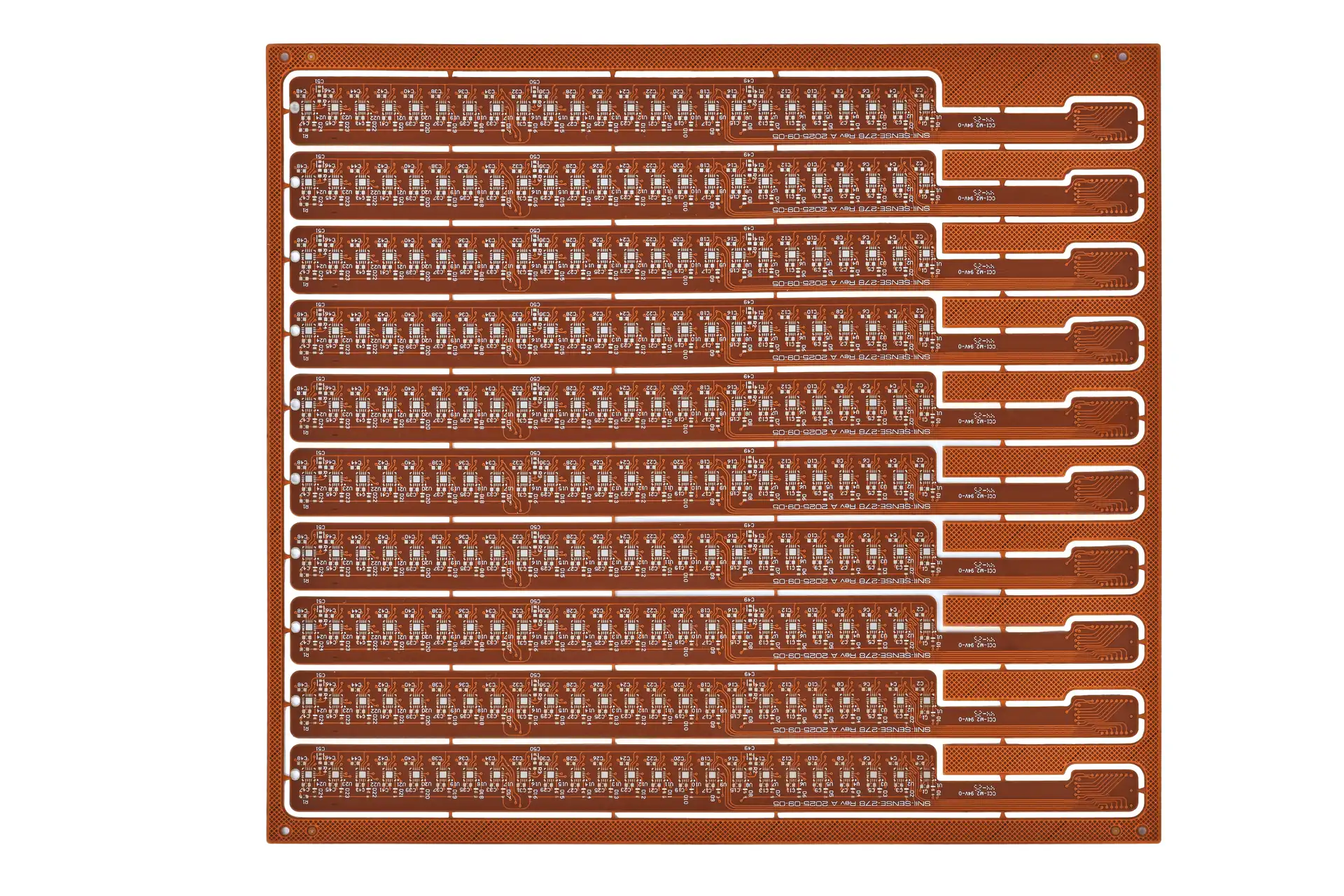 A panel of flexible printed circuits with repeated long circuit outlines.