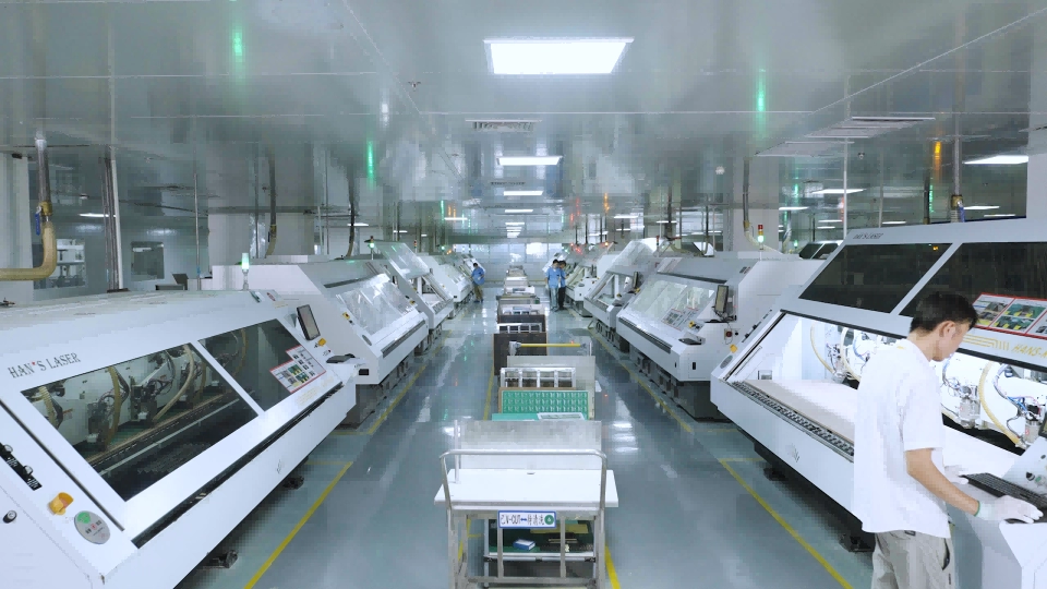 A row of PCB drilling machines in a clean production area, shown as general process context.