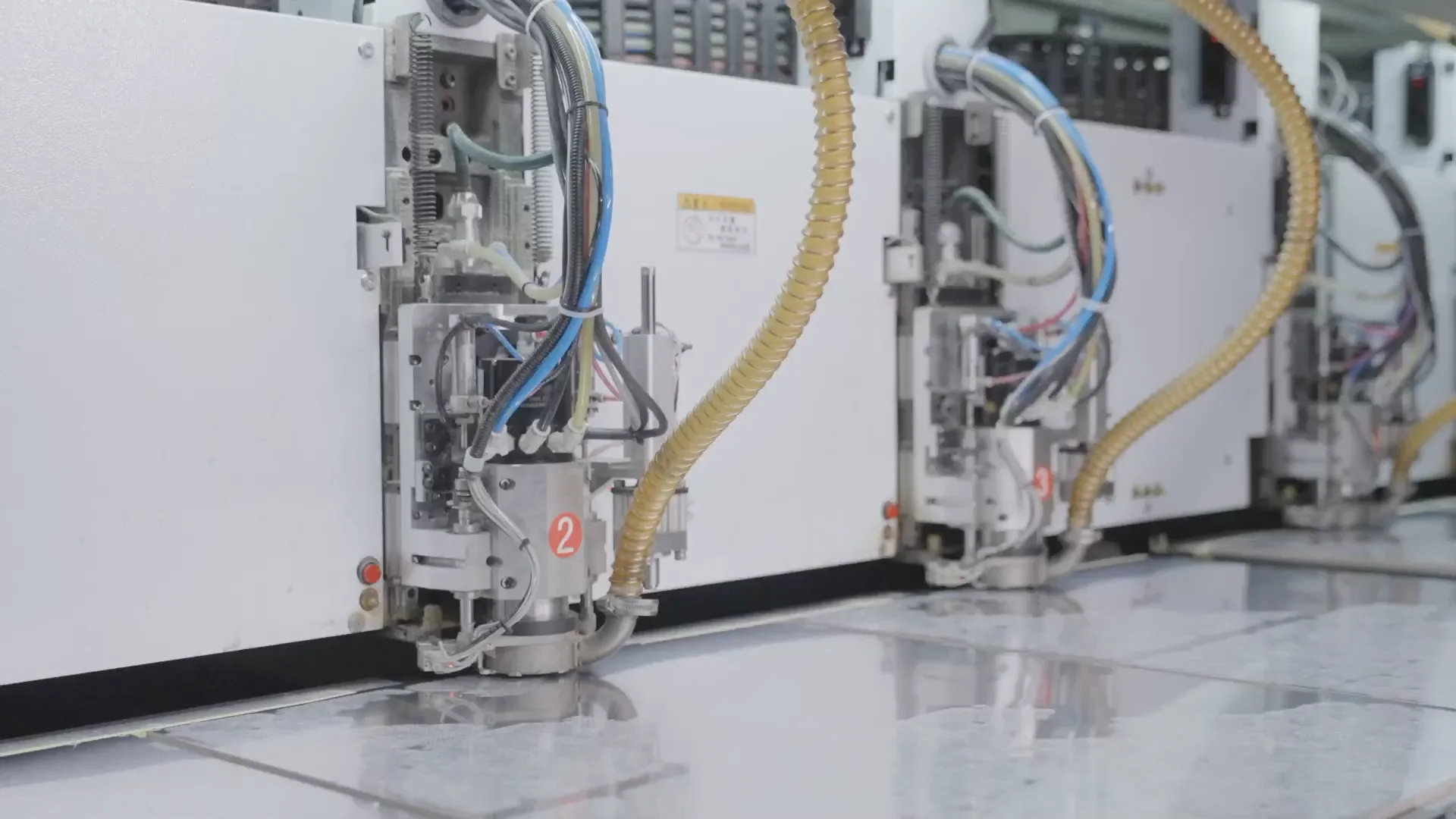 Mechanical PCB drilling machine preparing a panel for drilled-hole production